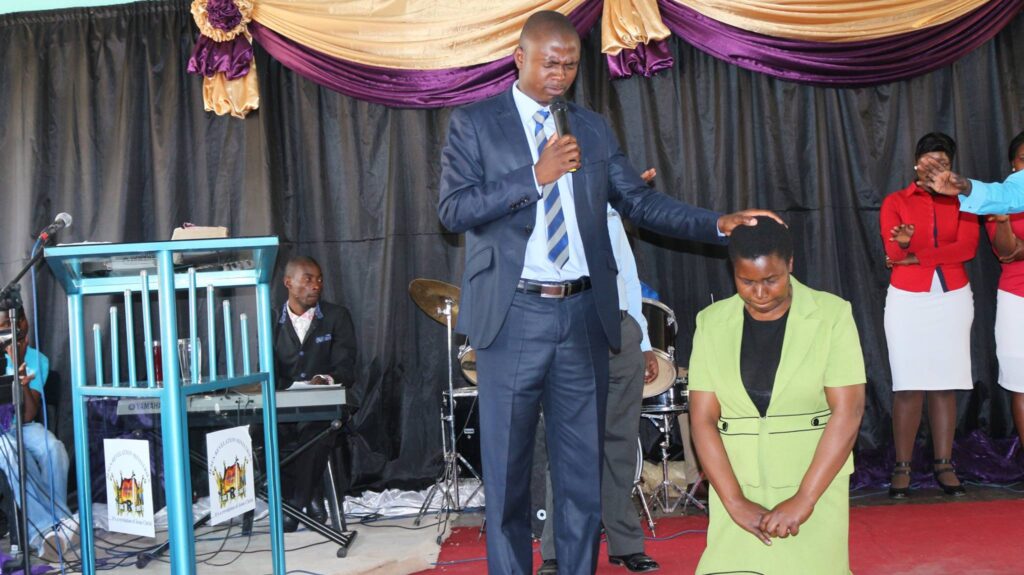 Apostle Chiwenga praying for Pastor Erengwe