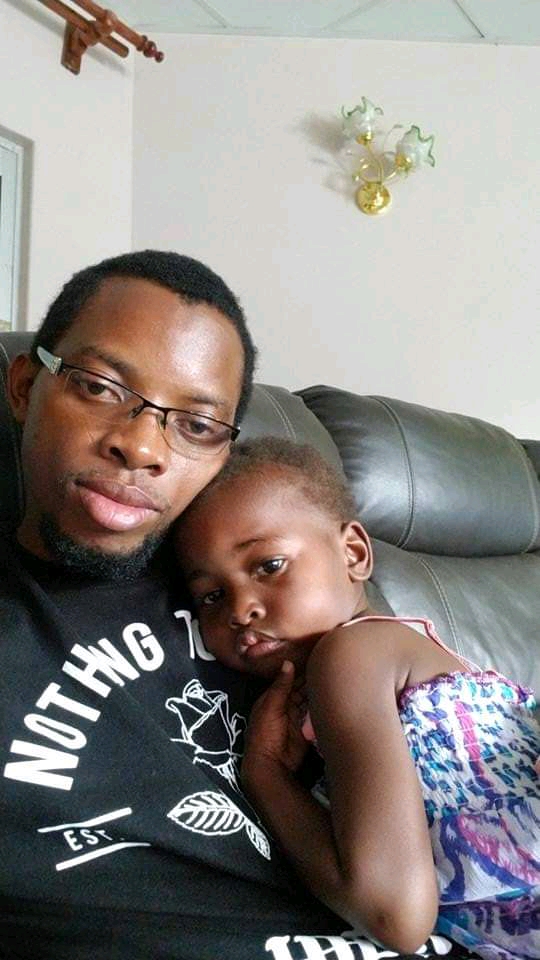 Romeo Kangombe with his little daughter 