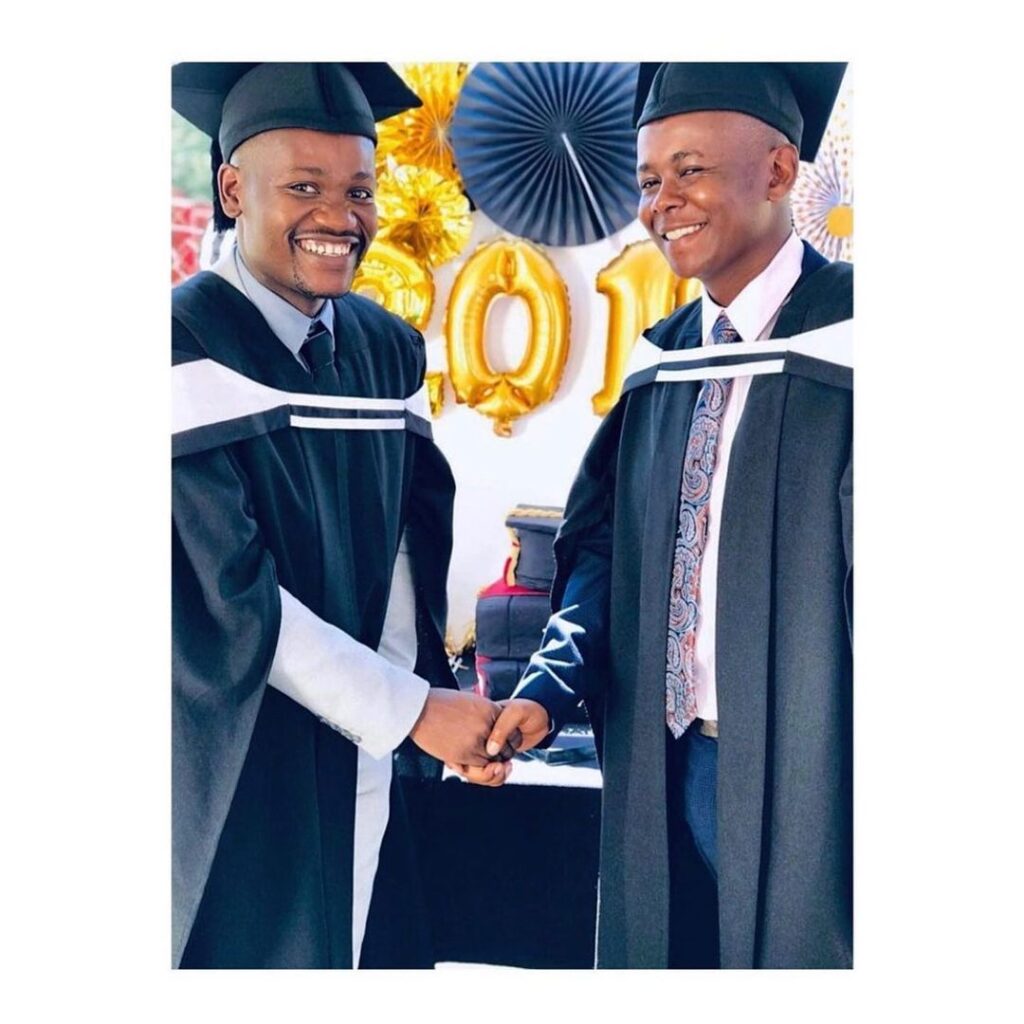 Image of Clement alongside T.bos from Skeem Sam during their graduation