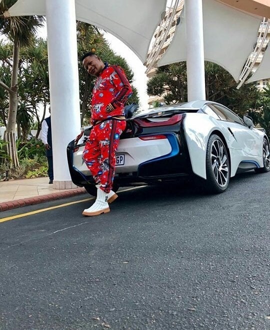 Lucky Gumbi with his BMW i8 car