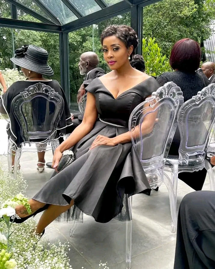 Image of Thembi in real life in a beautiful black dress.