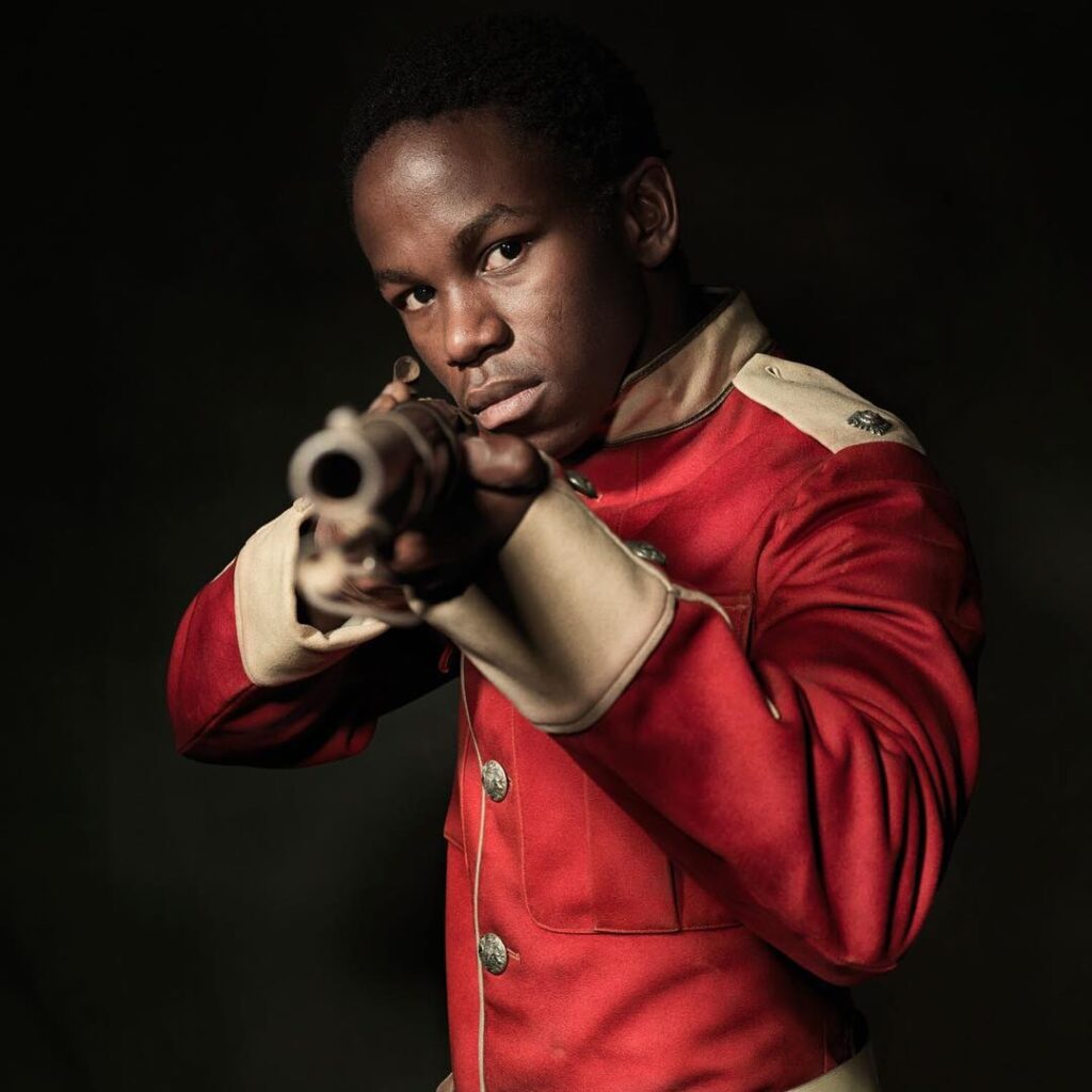 Image of Siyabonga Xaba portraying a character during photo shoot.