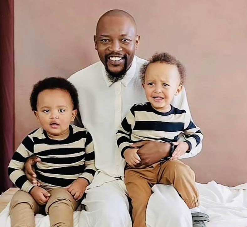 Moshe Ndiki with his children the twin boys.