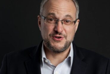 Stephen Grootes is a prominent South African political journalist, broadcaster, and author with over 20 years of experience in the media industry.